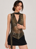 A woman modeling a sleeveless, high-neck wrap top with a distressed camouflage pattern in olive green, brown, and black, paired with a black mini skirt against a light gray studio background.