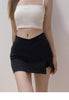 Women’s fitted black skirt featuring mini length, medium-stretch fabric, solid finish, and minimal side slit design.