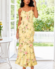 Yellow floral maxi dress with rose print and long flowing skirt.
