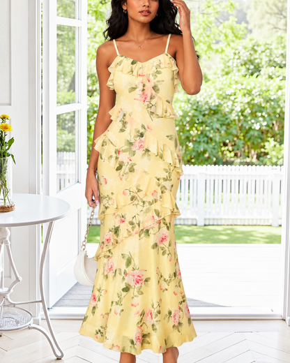 Yellow floral maxi dress with rose print and long flowing skirt.