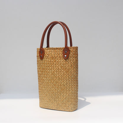 Natural straw beach tote with brown leather handles Dark