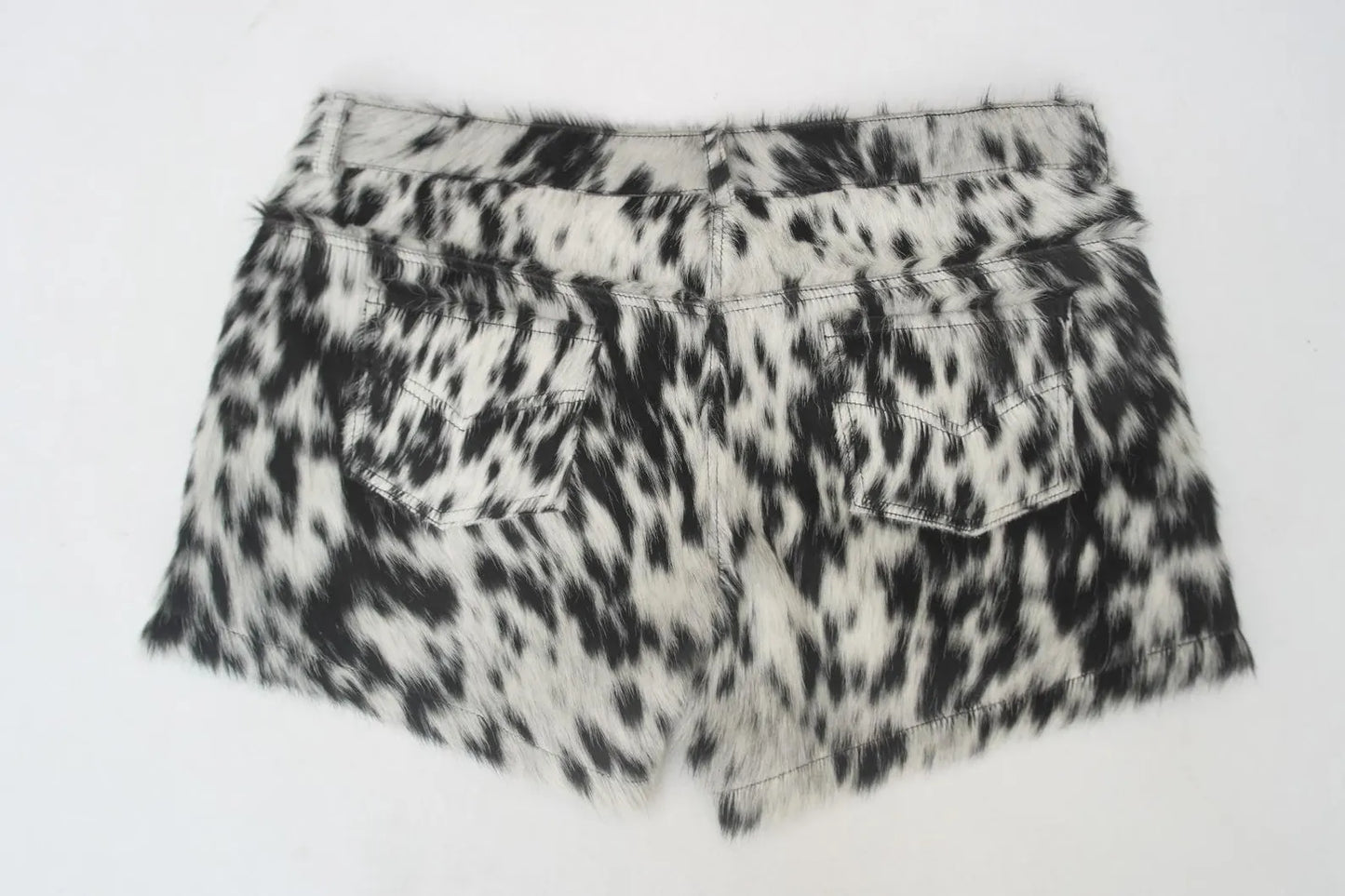 Mini cowhide shorts with black and white cow print for rodeo, country looks, or cowgirl styling. Real cow skin shorts made for bold southern fashion.


