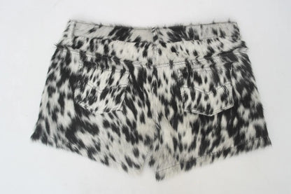 Mini cowhide shorts with black and white cow print for rodeo, country looks, or cowgirl styling. Real cow skin shorts made for bold southern fashion.

