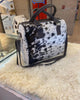 This cowhide shoulder bag combines pony skin texture and western fashion. Soft feel, standout look, and handcrafted style.

