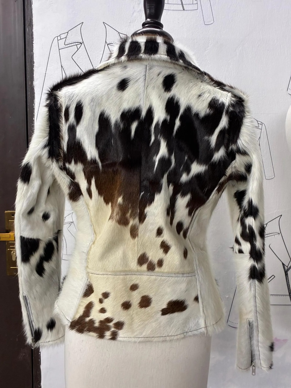 Get noticed in this cow print jacket women swear by. Real cowhide, tricolor tones, and handcrafted details make every jacket one of a kind.

