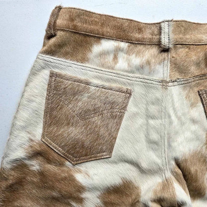 Cowhide shorts for men featuring real cow fur and strong denim-style structure—ideal for casual looks that demand something authentic and bold.
