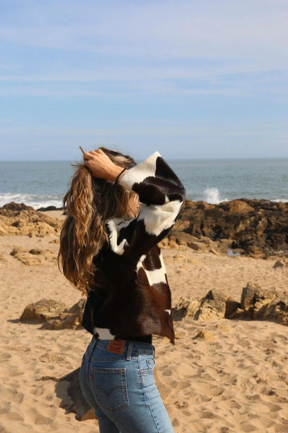 Make a statement in a real cow fur coat with cropped cut and visible grain—crafted from premium cowhide leather for casual layering.