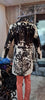 Make a statement with a cow jacket womens look—real cowhide leather, mid-thigh length, bold lapels, and a fitted waist belt.

