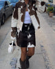 Cowhide leather jacket women love—paired with a real cow hide skirt for a complete Western cowgirl look. Each cow coat and skirt set features bold natural cow print.

