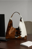 Brown white cowhide shoulder tote bag