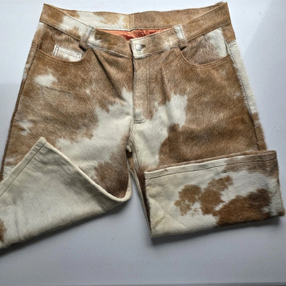 Add edge to your wardrobe with handcrafted cow skin men shorts, designed with one-of-a-kind cow fur patterns and classic five-pocket detailing.