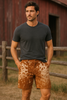 Western-inspired real cowhide shorts with black and white patches for rodeo, festivals, or country wear. Statement cow pattern design made from genuine hide.