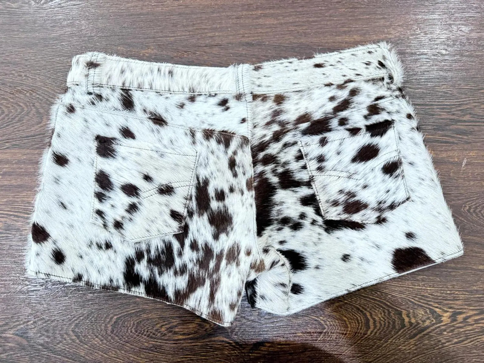 For rodeo nights or western gatherings, these speckled cow hair shorts add the perfect cowgirl feel. Great for horse racing and southern styling.