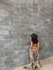 Stand out in brown white cowhide trousers with natural cow print pattern and flared cut. Ideal for western themes, southern fashion, and statement cowgirl pants styling.

