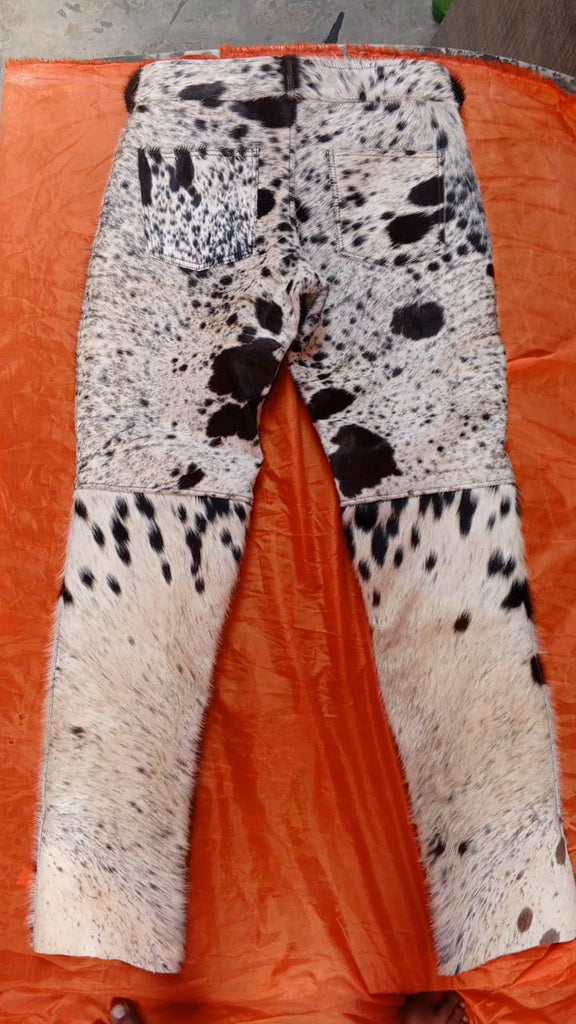 Real flared cowhide pants with hair-on finish in tricolor pattern. Each pair is unique with bold flare and handmade from authentic cow skin.

