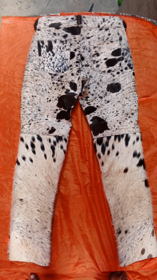 Real flared cowhide pants with hair-on finish in tricolor pattern. Each pair is unique with bold flare and handmade from authentic cow skin.

