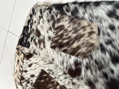 Men cowhide short made from real tricolor cowhide. Features flap pockets, folded hems, and a high-rise waist — each pair has unique leather patterning.