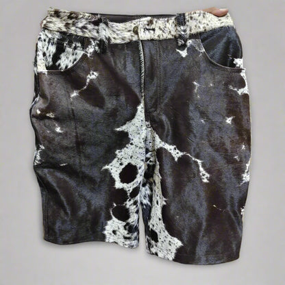 Men’s cowhide shorts made from real hair-on-hide. Black and white cow fur shorts for rodeo, western outfits, and country fashion.

