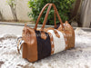Experience the allure of adventure with this cowhide weekender bag, designed for the wanderer in you.