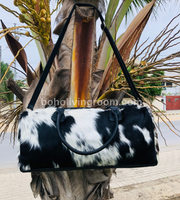 Travel in style with a cow fur weekender bag, a symbol of sophistication and practicality for the modern explorer.