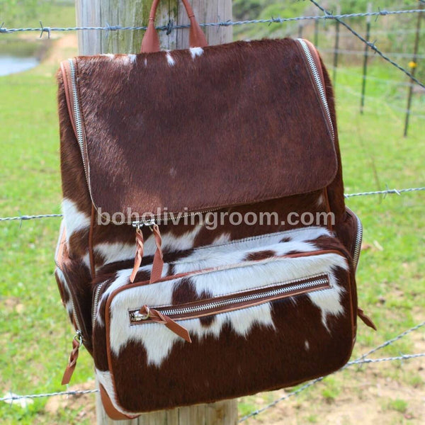 Functional cowhide backpack suitable for work or travel, featuring durable construction and thoughtful design elements.