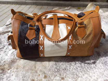 Indulge in luxury travel with this cowhide overnight bag, your essential companion for every trip.