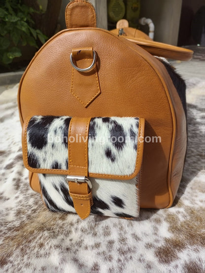 Hit the gym in style with this cow skin gym bag, designed to keep you organized and motivated.