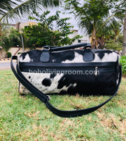 Unleash your wanderlust with a chic cow hide duffle bag, blending durability and elegance for your adventures.