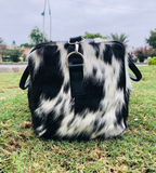 Experience luxury on-the-go with a refined cow fur duffle bag, designed to elevate your travel experiences.