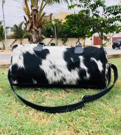 Elevate your travels with a sleek cow fur overnight bag, crafted for the discerning traveler in search of style.