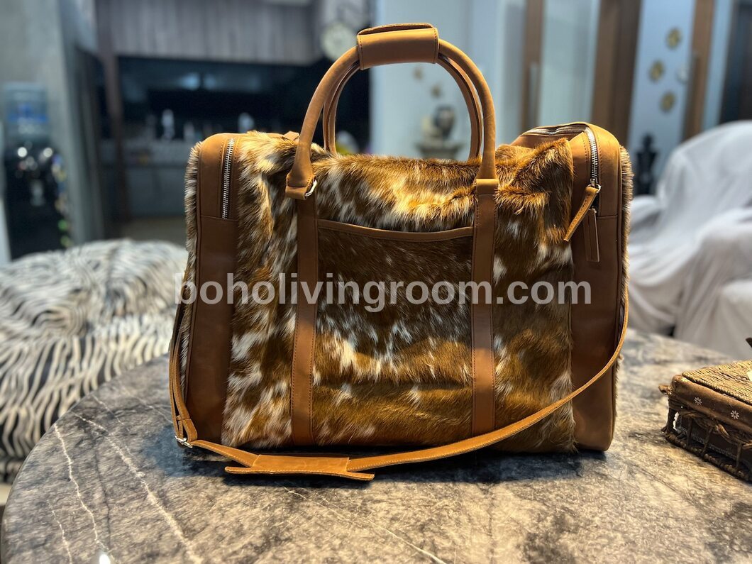 Experience luxury travel with this cow skin weekender bag, your ultimate getaway essential.