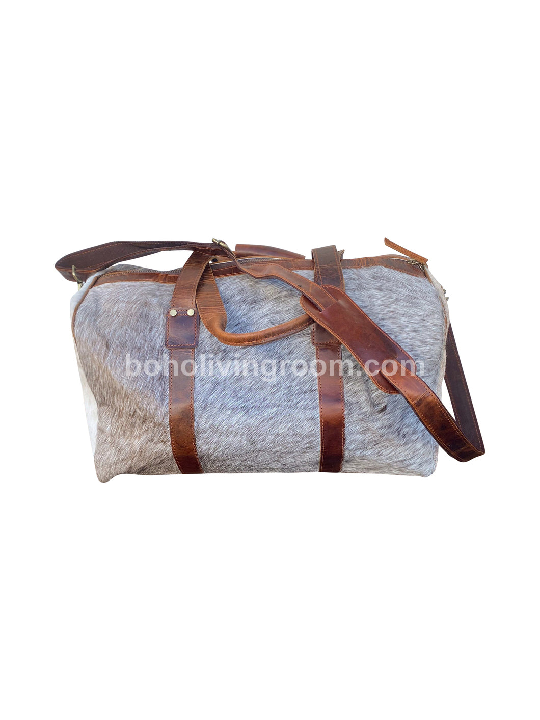 Make a style statement with this cow skin weekender bag, designed for the modern traveler with refined taste.