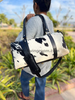Jet set in luxury with this cowhide overnight bag, meticulously crafted for the modern explorer.