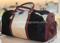 Experience luxury travel with this cow skin weekender bag, designed for the discerning traveler.