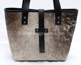 Discover the allure of a cowhide handbag