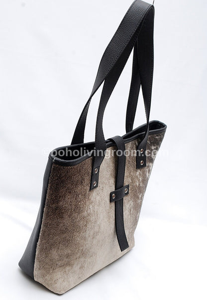 Elevate your look with a cowhide bag.