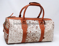 Make a statement on your travels with this cowhide weekender bag, reflecting your refined taste.