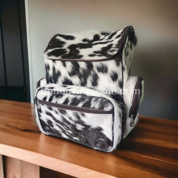 Unique cow fur backpack with a rustic charm, showcasing the natural beauty of cowhide in a distinctive and eye-catching design.