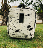  Elevate your travel game with our top-quality cowhide duffle bag. Spacious, sturdy, and stylish, it's the ultimate travel accessory.