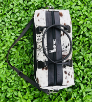  Take on any adventure with our reliable cowhide duffle bag. Designed for durability and comfort, it's the perfect travel solution.