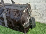 Make every journey count with this cowhide overnight bag, crafted for comfort and style.