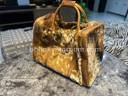 Indulge in luxury with this cowhide overnight bag, your perfect travel accessory.