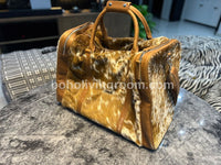 Indulge in luxury with this cowhide overnight bag, your perfect travel accessory.