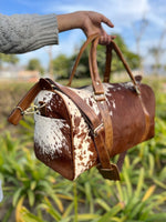 Travel with ease using our cowhide duffle bag. Reliable companion.