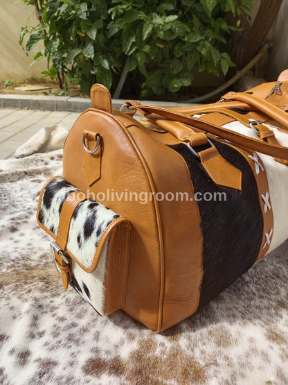Embrace wanderlust with this cowhide travel bag, a symbol of adventure and luxury for the modern explorer.