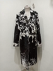 Make a statement with this genuine cow fur trench coat featuring black and white cowhide panels. A long cowhide jacket perfect for rodeo, ranch looks, and cowboy-inspired fashion.

