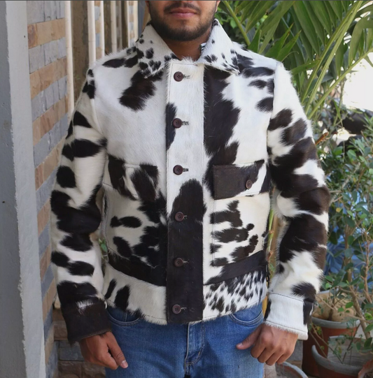 Men’s cowhide jacket made from real hair-on-hide leather in natural black and white cow print. Unique cowhide coat designed for fall, winter, or rodeo wear.

