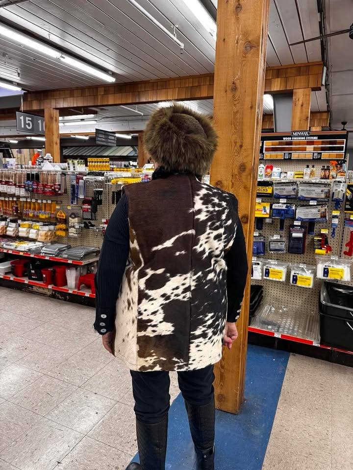 Women’s cowhide vest with front button closure and bold cow pattern. Shop hair-on cow fur jacket for winter wear or rodeo-ready western looks.

