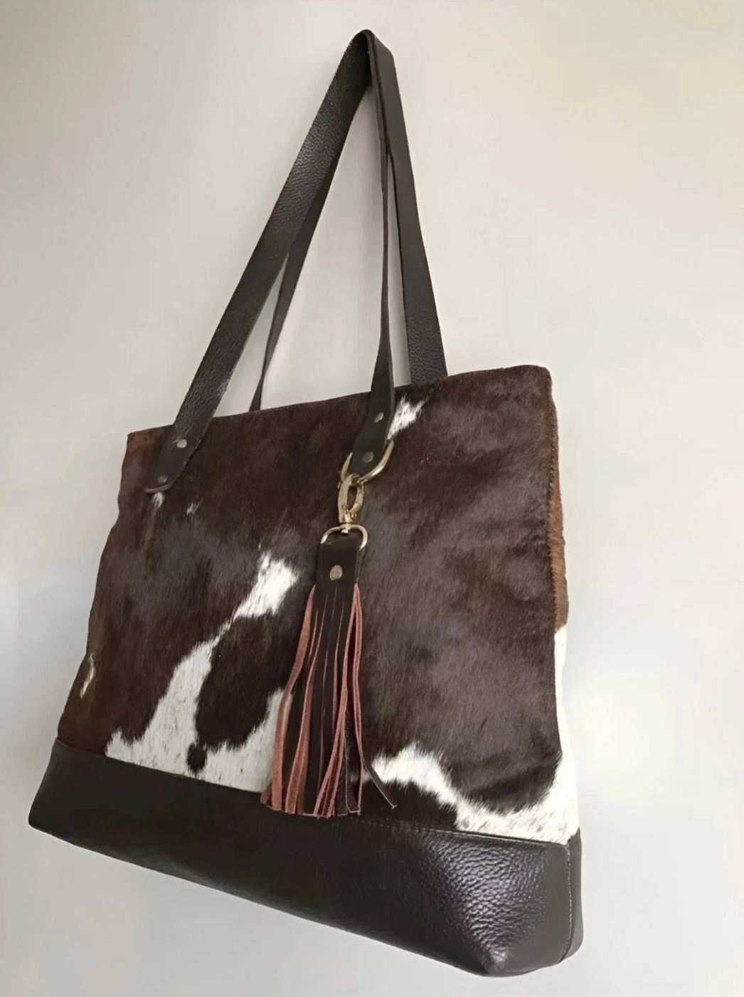 Brown white cowhide bag with fringe tassel