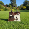 Brown white cowhide pocket tote bag